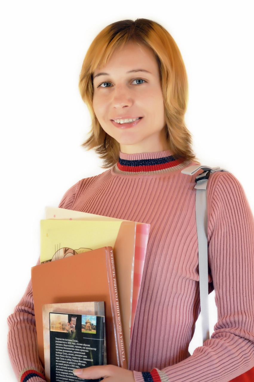 Student holding textbooks and study materials while researching Refinance Student Loans With Good Credit, comparing options for Student Loans after FAFSA, understanding an Unsubsidized Student Loan, evaluating an Unsubsidized Loan, and searching for the Lowest Rate Student Loan Refinance opportunities.
