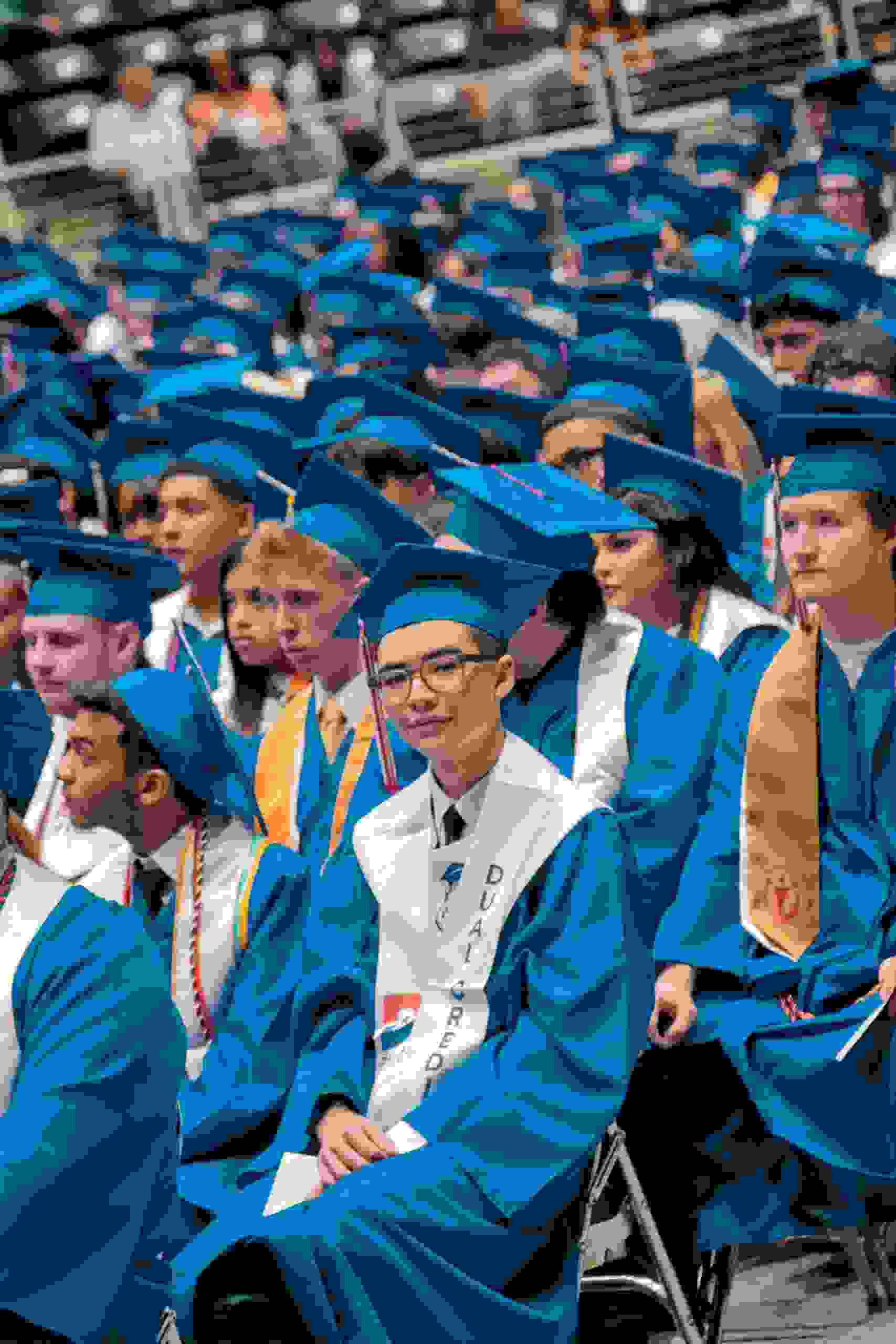 Large group of graduates at a commencement ceremony celebrating academic success while exploring Education Loans, learning How to Apply for Student Loans, accessing a Student Loan Login, and completing a Superb Student Loan Application in 2026 to help fund higher education goals.