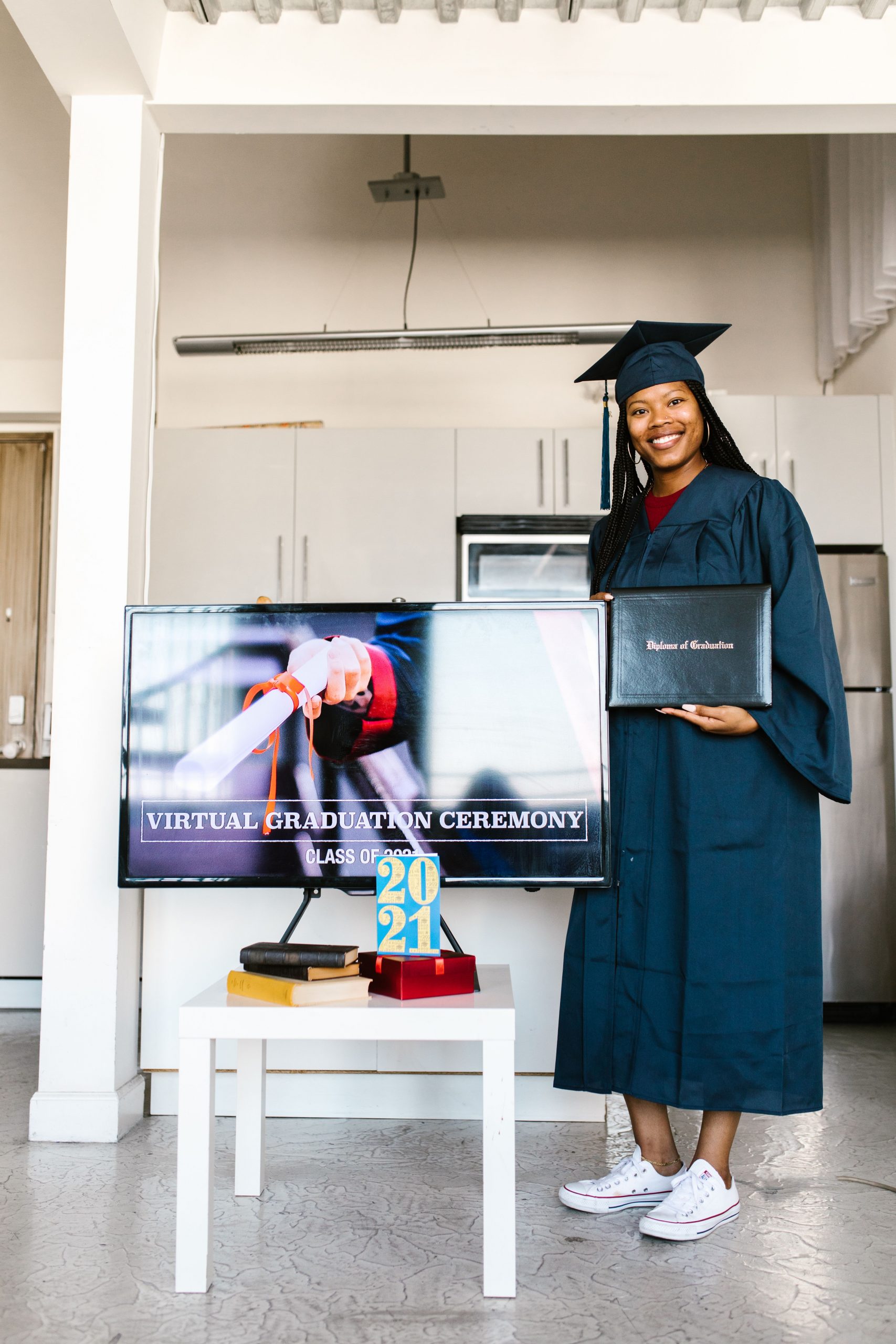 Graduate celebrating a virtual commencement ceremony while researching Student Loan Refinance Reviews, exploring Student Loan Refinance for International Students, deciding whether to Refinance my Student Loans, reviewing repayment resources from Student Loan Gov, and comparing Student Loan Refinance opportunities after earning a degree.